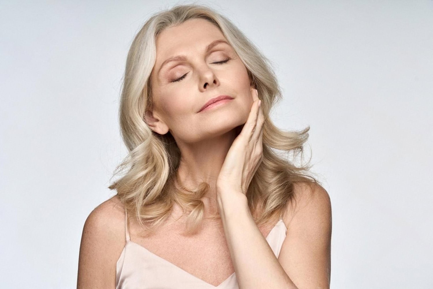 Mature woman with firm, smooth neck skin after aesthetic treatment in Dubai